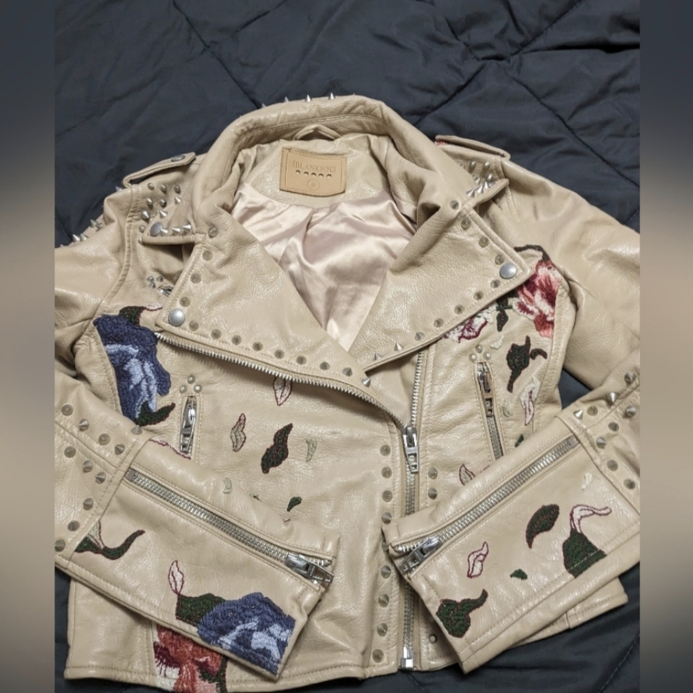 Blank NYC  cream embroidered vegan leather motorcycle jacket with spikes size sm